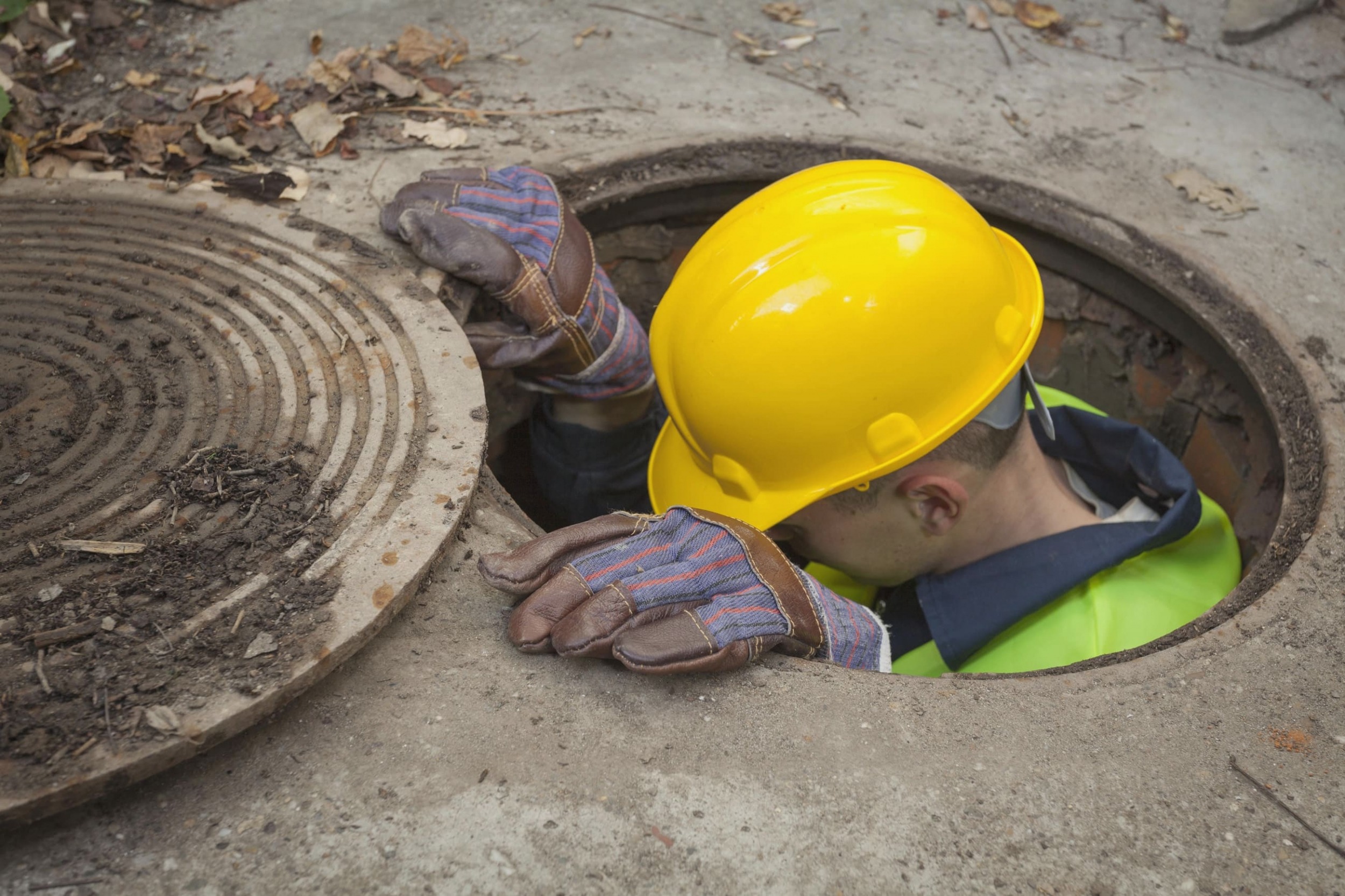 ETQ reliance quality management metals and mining man going down metal manhole