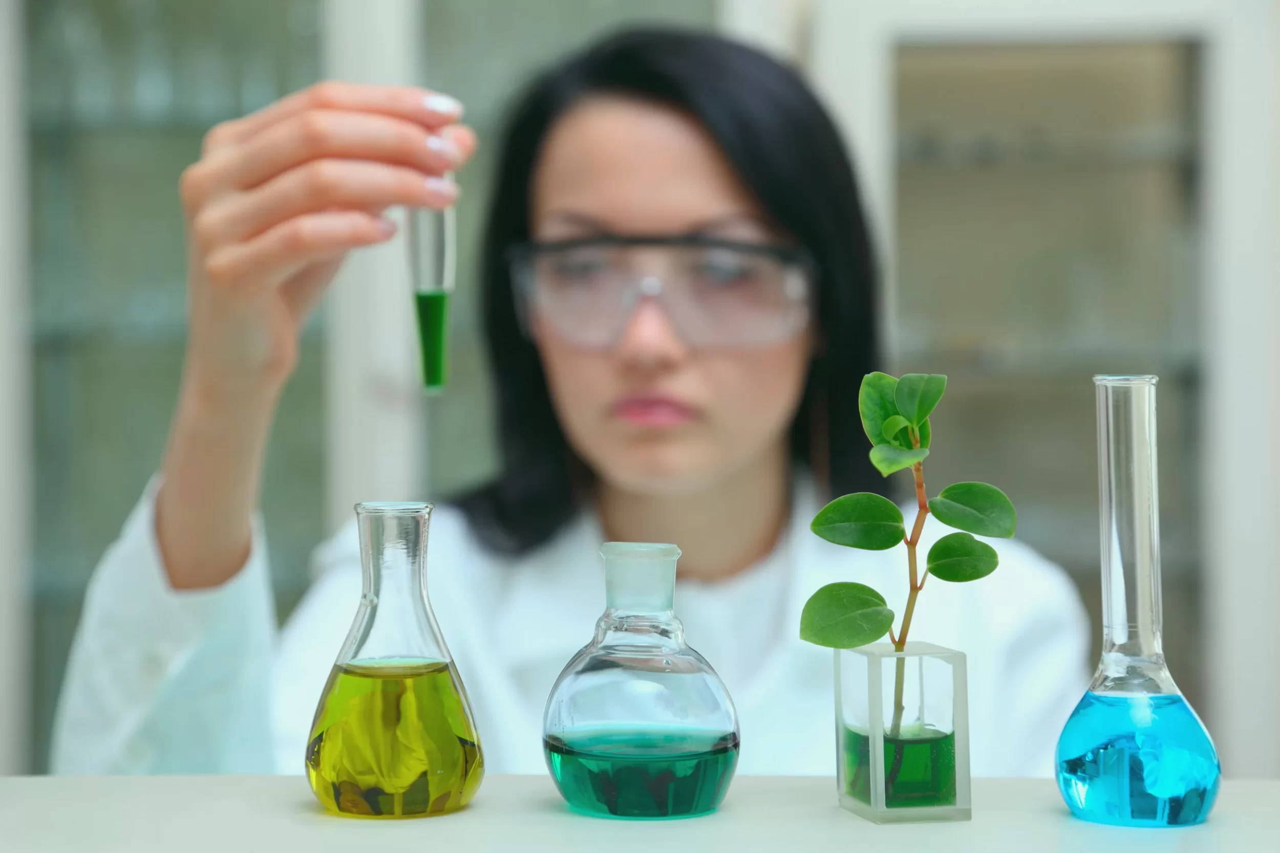 stock image of a chemist for a solutions page for quality management software for chemical companies
